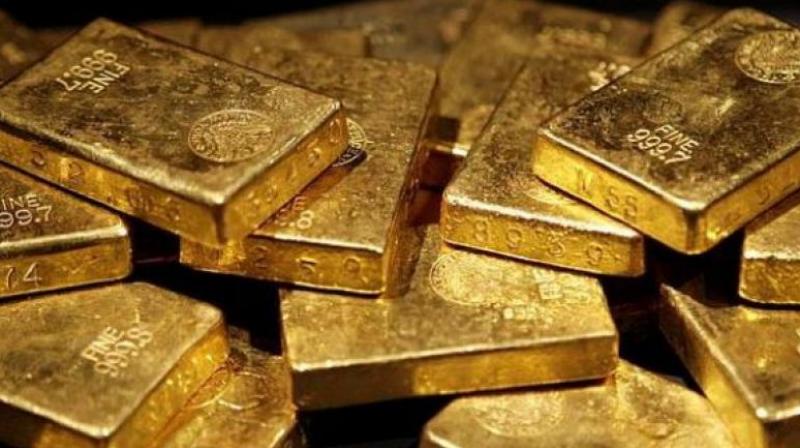 Gold prices went down by Rs 200 to Rs 31,350 per ten grams at the bullion market on Friday.