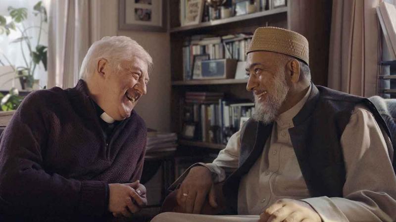 The ad showcases the warm friendship between a Christian priest and a Muslim Imam who also happen to be neighbours.(Credit: YouTube)