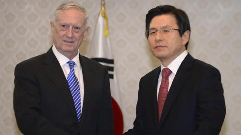 US Defense Secretary James Mattis shakes hands with South Koreas acting President Hwang Kyo-ahn, prior their meeting at the Government Complex in Seoul. (Photo: AP)