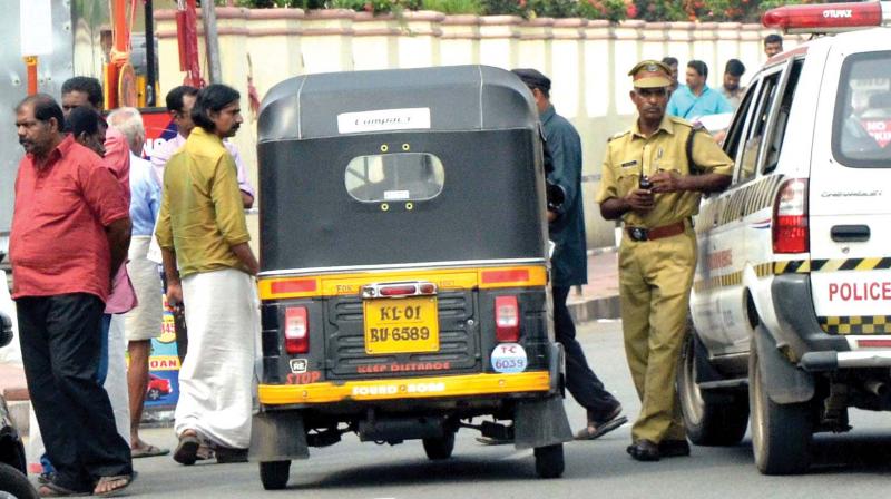 Activists block an auto during hartal in Thiruvananthapuram on Monday. (Photo:  DC)
