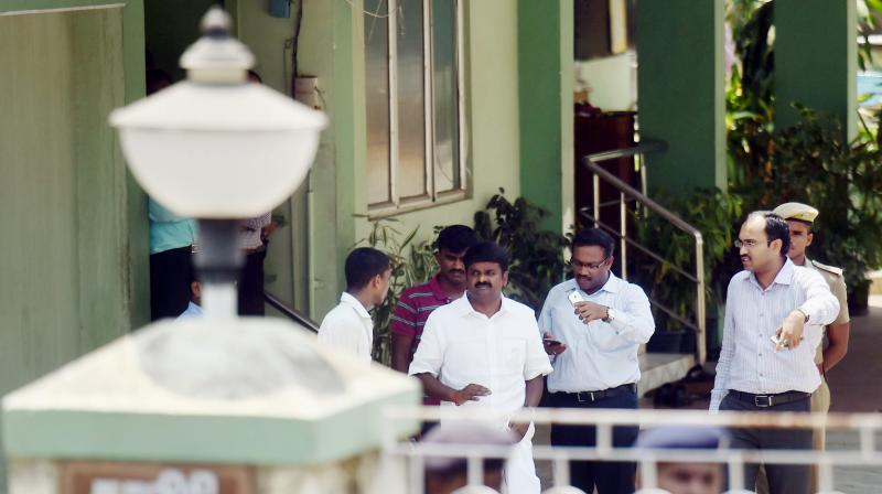 Tamil Nadu Health Minister Vijaya Baskar with Income Tax department officials during a raid by them at his residence in Chennai. (Photo: PTI)