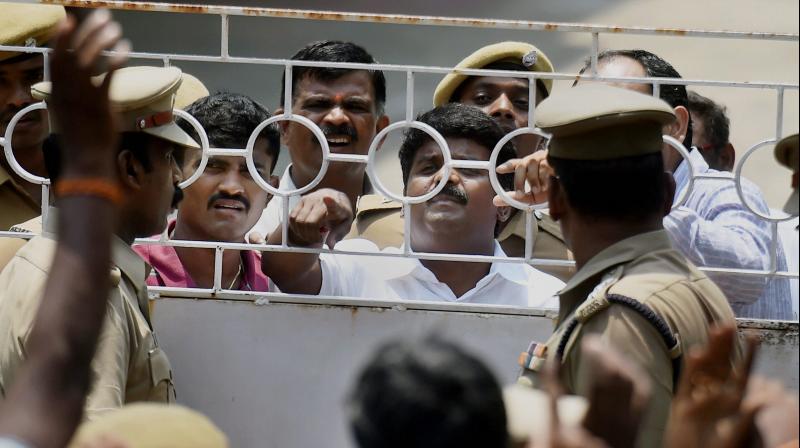 Tamil Nadu Health Minister C Vijayabaskar in an argument with the police personnel during a raid at his residance by the Income Tax department in Chennai. (Photo: PTI)