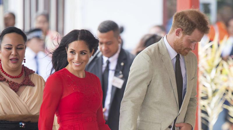 Britains Prince Harry and Meghan, Duchess of Sussex in arrive at Fuaamotu Airport in Tonga, Thursday, Oct. 25, 2018. (Photo: AP)