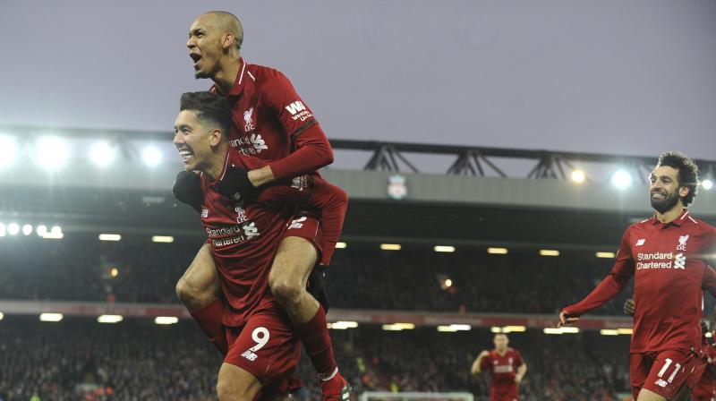 Firmino celebrates with his teammate Fabinho and Salah after scoring his sides second goal during the match between Liverpool and Crystal Palace. (Photo: AP)