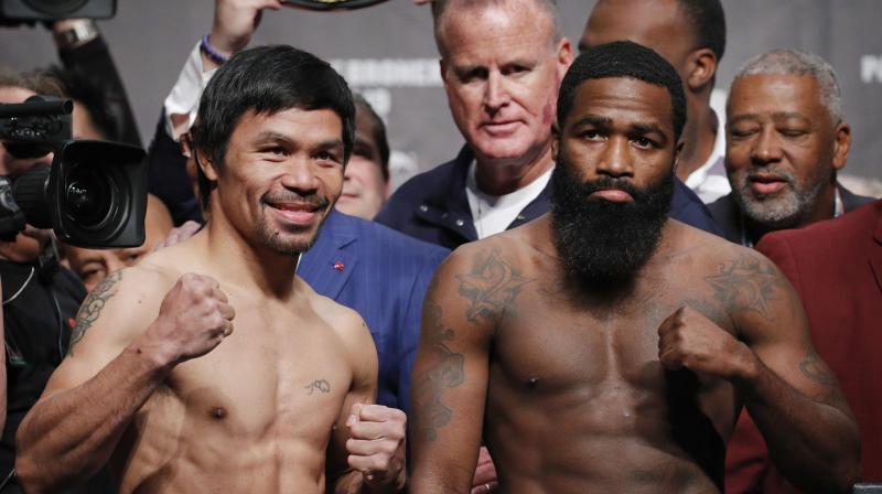 Manny Pacquiao and Adrien Broner pose during a weigh-in. (Photo: AP)