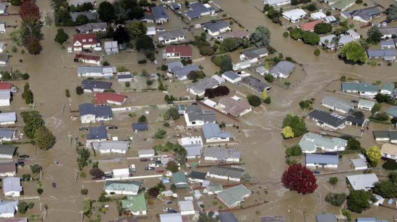 Local authorities declared a state of emergency after the levee failed in the town of Edgecumbe on the North Island. (Photo: AP)