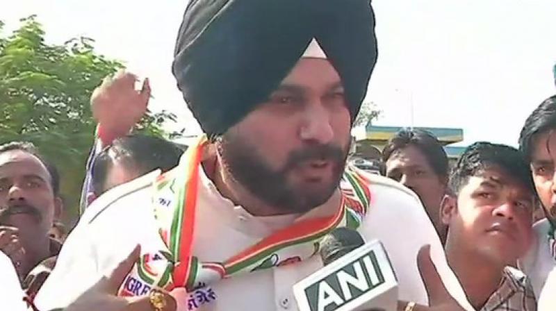 Realising the gravity of the unsavoury remark, Sidhu said: You dont want to wash dirty linen in public. He (Capt Amarinder Singh) is a fatherly figure, I love him, I respect him; I will sort it out myself. (Photo: ANI)