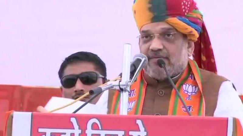 Addressing an election rally here, Shah said, I have been repeatedly asking Rahul Gandhi to name the leader of his party...But he doesnt say anything. (Photo: ANI | Twitter)