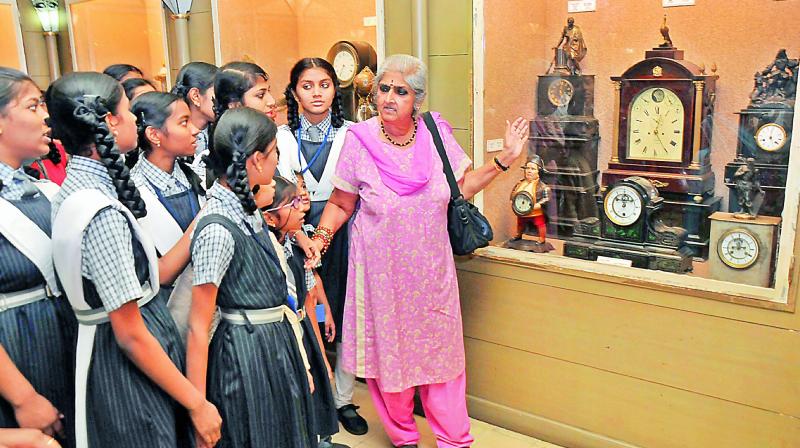 Intach, Hyderabad Chapter, convenor P. Anuradha explains to visitors the antique clocks at the Special Historic Clock Collection housed in the Salar Jung Museum, Hyderabad, on Saturday. (Photo: DC)