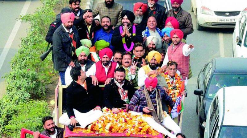 Former BJP MP-turned-Congressmen Navjot Singh Sidhu being welcomed upon arrival by Congress leaders during a road show at Amritsar on Tuesday. (Photo: PTI)