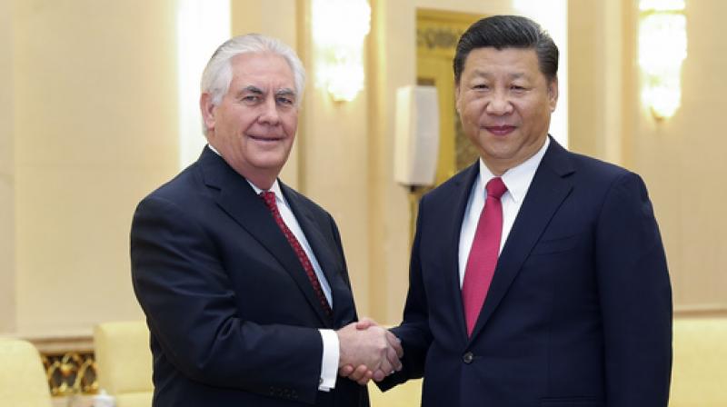 Xi Jinping met Rex Tillerson as the two sides haggle behind closed doors over a summit with Donald Trump, a frequent China critic. (Photo: AP)