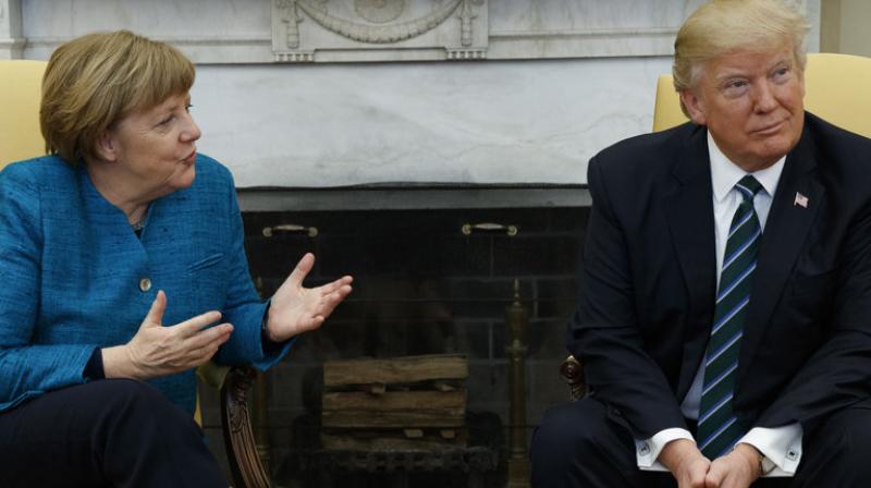 Angela Merkels suggestion of another handshake went unheard or ignored by Donald Trump. (Photo: AP)