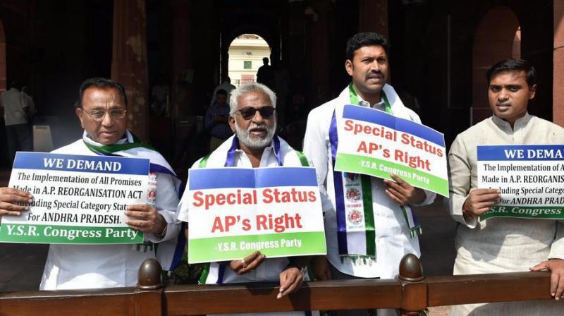 YSR Congress lawmakers protesting outside the Parliament, demanding special status for Andhra Pradesh. (Photo: PTI | File)