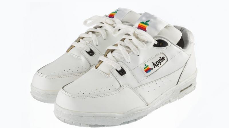 The white sneakers feature the old rainbow Apple logo on the side. The shoes are extremely rare, not because they are old but they never left the prototype stage.