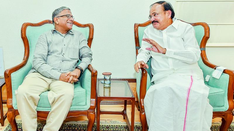 Vice-President M. Venkaiah Naidu with the newly-elected deputy chairman of the Rajya Sabha Harivansh Narayan Singh in New Delhi on Thursday. (Photo: PTI)