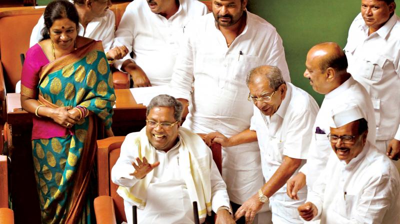 Chief Minister Siddaramaiah, former minister Shamanur Shivashankarappa and newly elected MLA Geetha Mahadevprasad have a hearty laugh during the Assembly session at Vidhana Soudha on Monday.