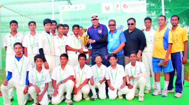 All Saints cricket team pose with VVS Laxman after winning the VVS Cup inter-schools tournament.