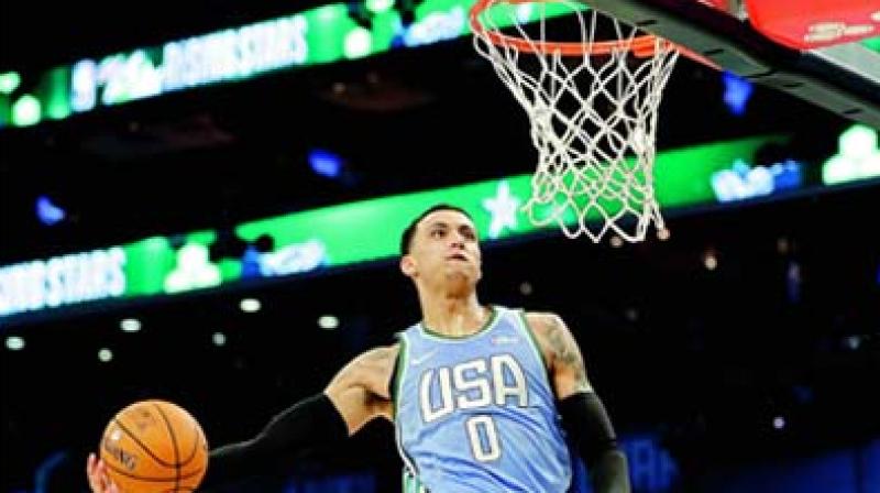 Team USAs Kyle Kuzma goes for a dunk against Team World during the NBA All-Star Rising Stars game on Friday in Charlotte. (Photo: AP)