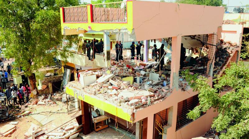 A gas leak caused a cylinder to burst in the house (in picture) on Friday, killing the owner and a passerby. Police started investigation into the incident that occured at Kapra. The blast also damaged the surrounding buildings. 	 DEEPAK DESHPANDE