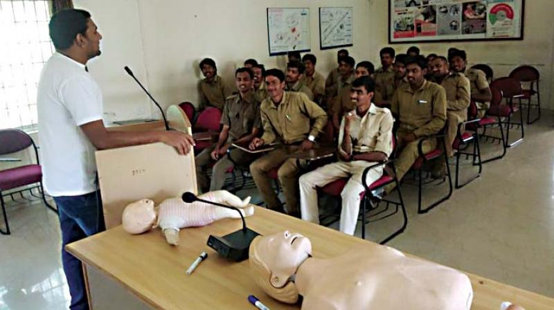 A Golden Hour team member trains BMTC drivers and conductors in first-aid, in Bengaluru