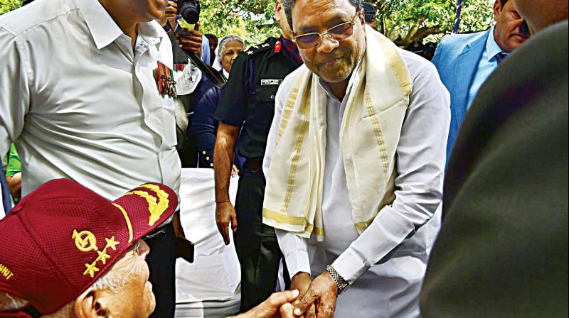 Chief Minister Siddaramaiah takes part in a function organised to mark Kargil Vijay Divas in Bengaluru on Wednesday (Photo: DC)