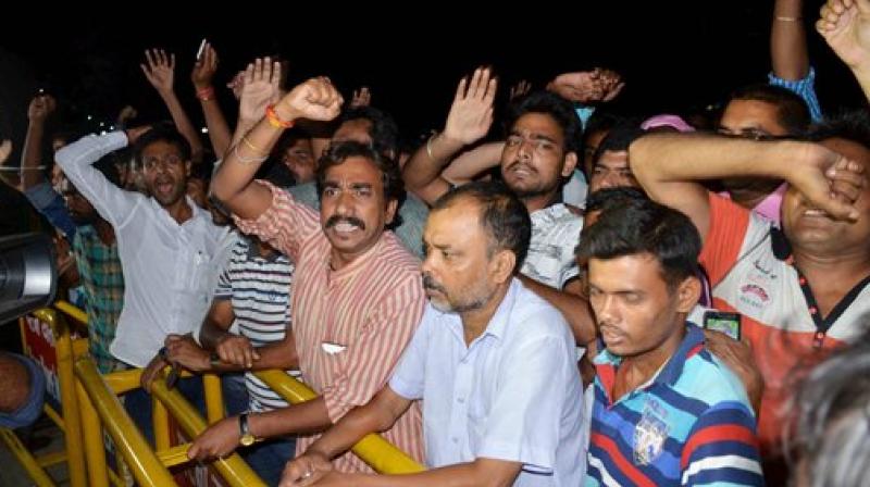 Supporters of Rashtriya Janata Dal shout slogan after Bihar Chief Minister Nitish Kumar resigned in Patna on Wednesday. (Photo: PTI)