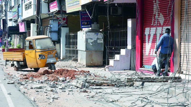 A concrete mass of Chandralok Complex which fell on a passerby killing him on the spot near Paradise circle, Secunderabad, on Tuesday.