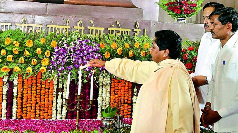 BSP supremo Mayawati pays tribute to Dr B.R. Ambedkar  in Lucknow on Friday. (Photo: PTI)
