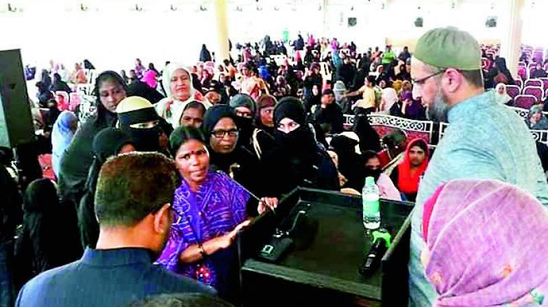 Majlis Chief, Asaduddin Owaisi meeting a womens group at Nampally on Tuesday.