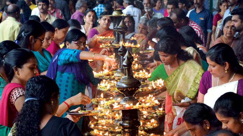 Devotees light Naranga Villaku as part of Pongala festival at Attukal temple in Thiruvananthapuram on Thursday.  (Photo: SABARI NATH)