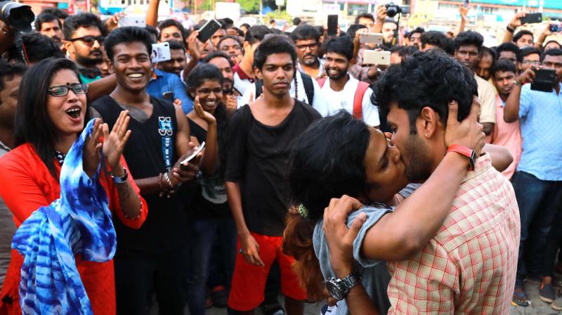 Activists protest Shiv Senas moral policing by kissing in public at the Marine Drive in Kochi on Thursday. (Photo: ARUN CHANDRABOSE)