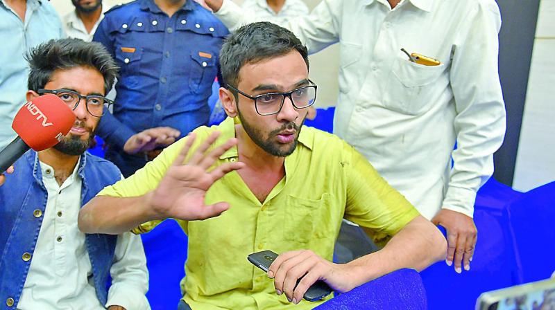 Jawaharlal Nehru University student Umar Khalid speaks to the media moments after he was shot at, on Monday.
