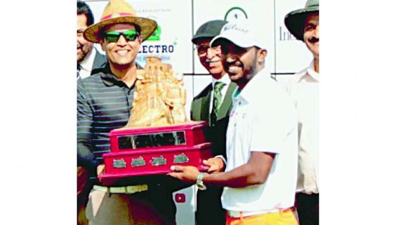 S. Chikkarangappa with the winners trophy.