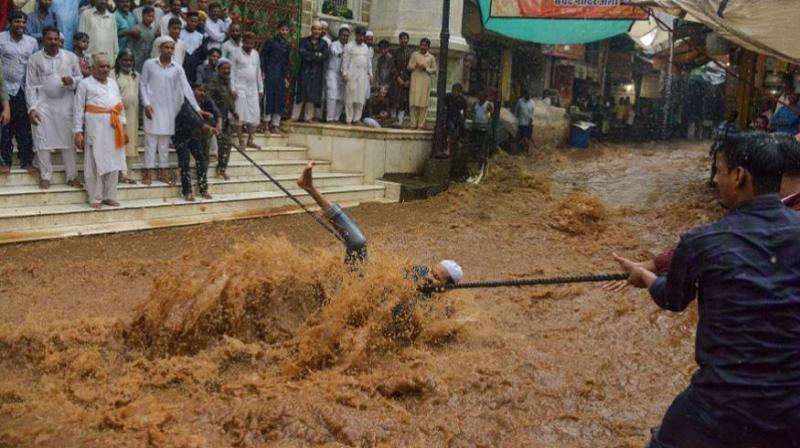 In pictures: Monsoon drowns India