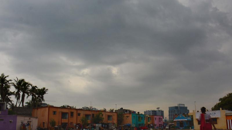 Dark clouds engulfing the sky at Pattinapakkam Foreshore Estate on Friday. (Photo: DC)