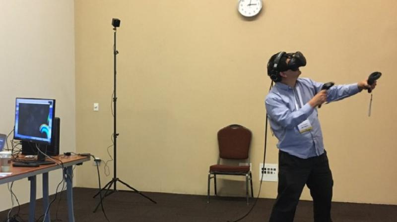 Dean Takahashi of GamesBeat plays Arcade Saga on the HTC Vive. (Image: HTC)