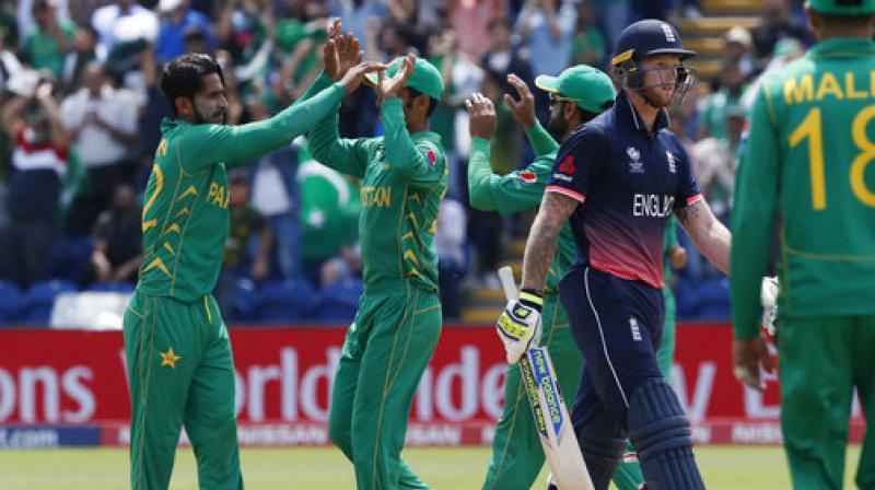 Pakistans players celebrate taking the wicket of Englands Ben Stokes, right, during the ICC Champions Trophy semifinal cricket. (Photo: AP)