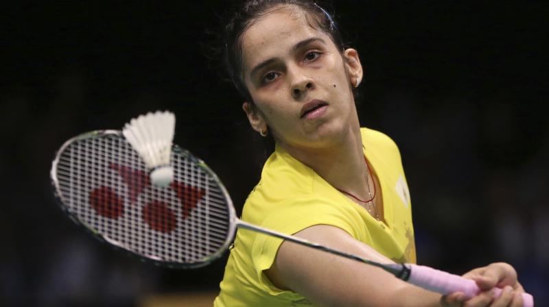 Indias Saina Nehwal plays against Thailands Nitchaon Jindapol during their womens singles second round match at the Indonesia Open. (Photo: AP)