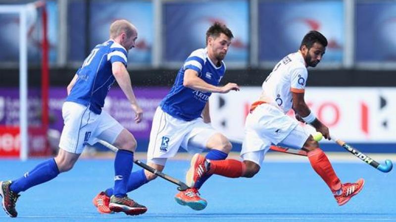 Indian captain Manpreet Singh (White) in action against Scotland (Photo: FIH)