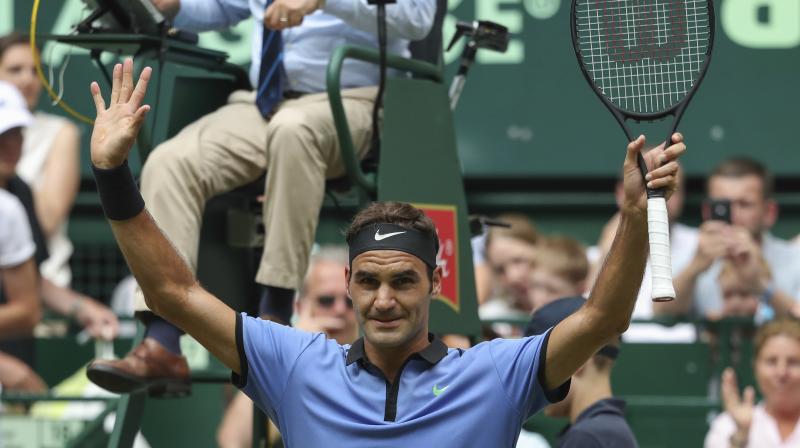 Switzerlands Roger Federer celebrates his win over Japans Yuichi Sugita during the Gerry Weber Open ATP tennis tournament in Halle. (Photo:AP)