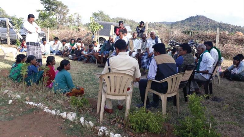 Forest officials holding a meeting with people of Chengadi village near Male Mahadeswara Hills in Chamarajanagar district.