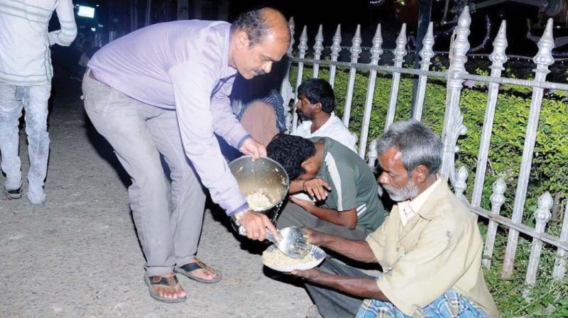 AAF founder H.R. Rajendra serving food to the poor in Mysuru.