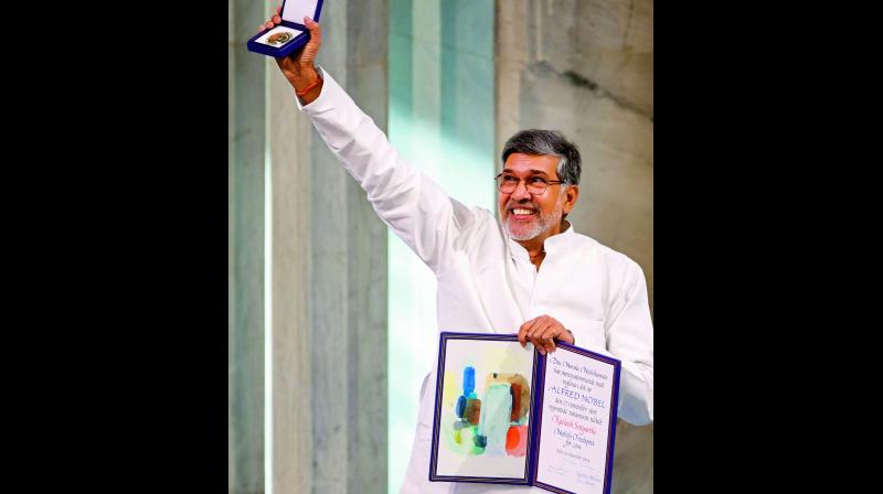 Nobel Peace Prize winner Kailash Satyarthi with his Nobel Prize citation