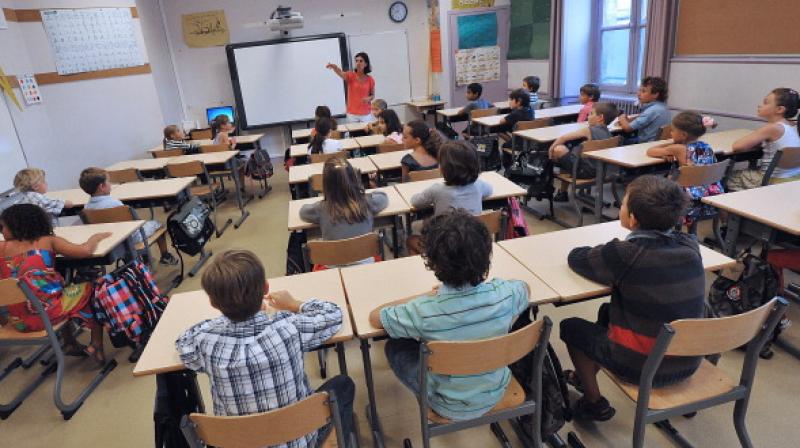 Teachers rated them as less academically able as early as elementary school (Photo: AFP)