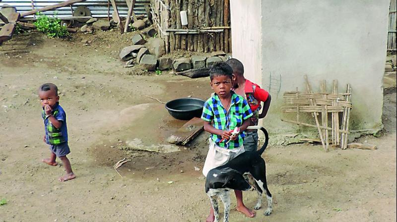 Children play near an Individual Sanitary Latrine in Token Movvad village in Kerameri mandal of Kumarambheem Asifabad district. (Photo: DC)