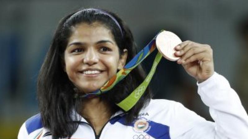 Sakshi Maliik after winning bronze medal in the Rio Olympics last year. (Photo: AFP)