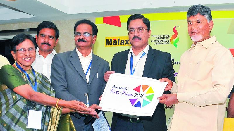 Chief Minister N. Chandrababu Naidu releases the logo of Amaravati Poetic Prism-2016 at Berm Park in Vijayawada on Monday. (Photo: DC)