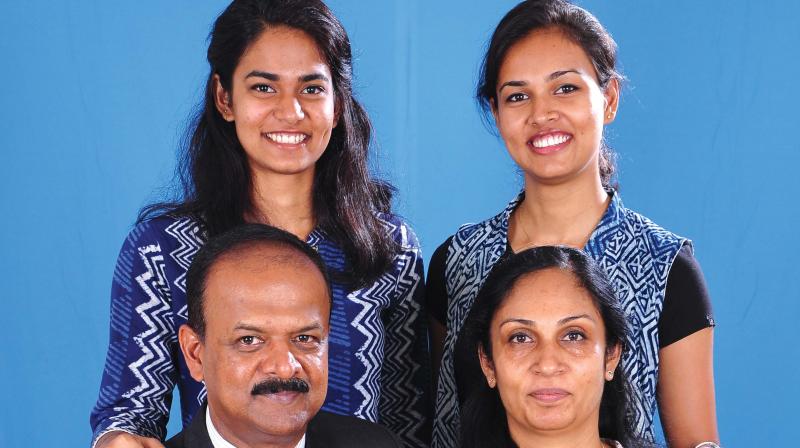 Tanya (right, standing) with her family.