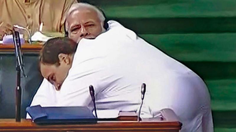 First off Rahul Gandhi, after his touted kick ass speech in the Lok Sabha, walks up unannounced to the Prime Minister sitting in the Treasury benches, across the well of the House, and proceeds to hug Modi, his head resting touchingly on the startled PMs shoulder, catching him completely off guard.