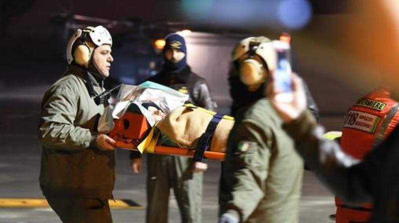 One of the three children that were rescued from the avalanche-hit Rigopiano Hotel is transported to a hospital in Pescara. (Photo: AP)